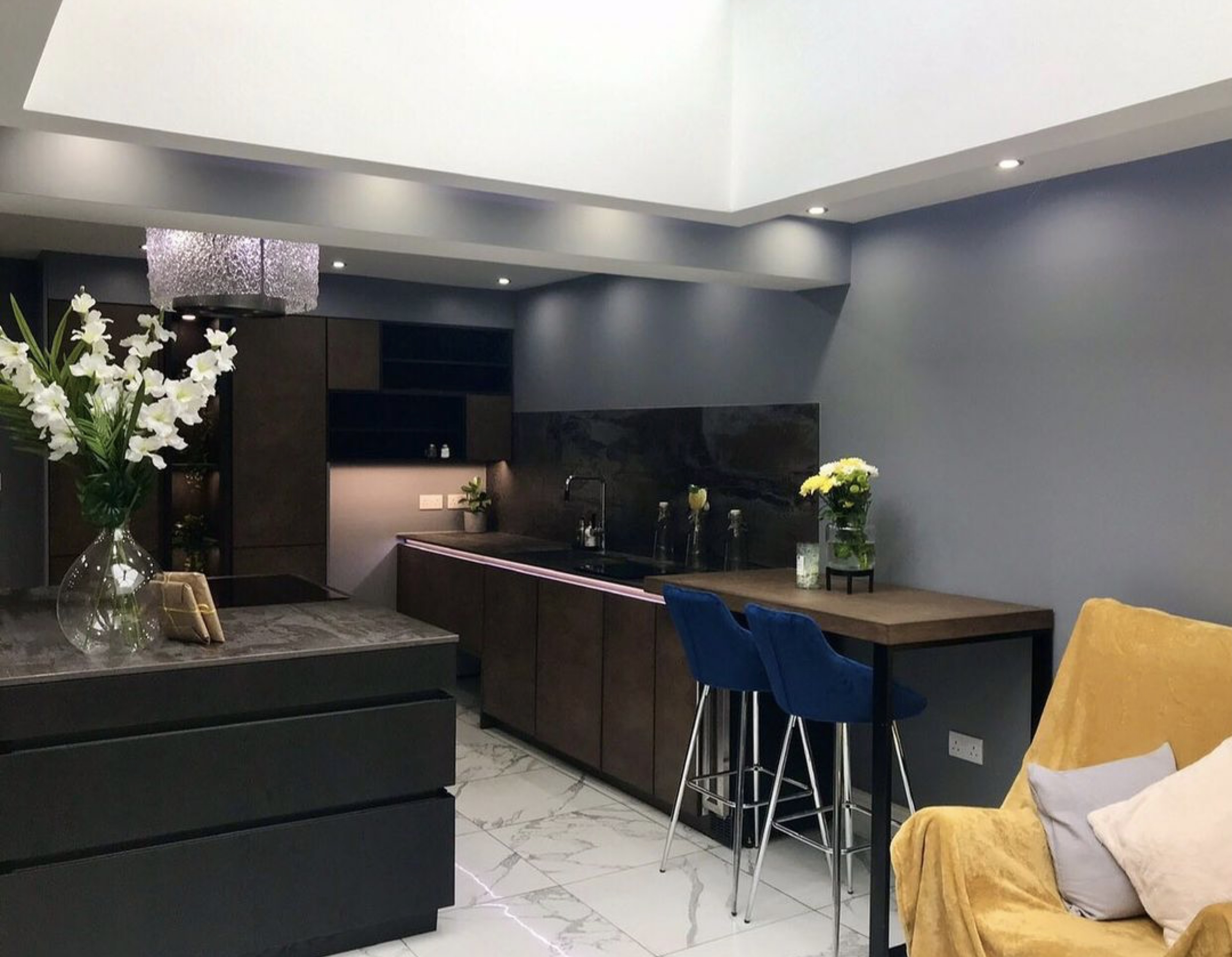 Image of open plan kitchen featring Nest Faber extractor